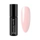 Colored rubber base gel honey peach that strengthens natural nails and provides smooth even coverage with soft peach tone